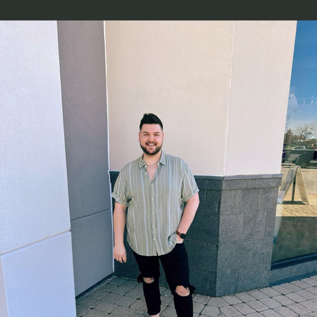 Image is of Lucas Hill, guest on The She Sells Differently podcast, he is standing outside, smiling at the camera, with one hand tucked into his pocket.