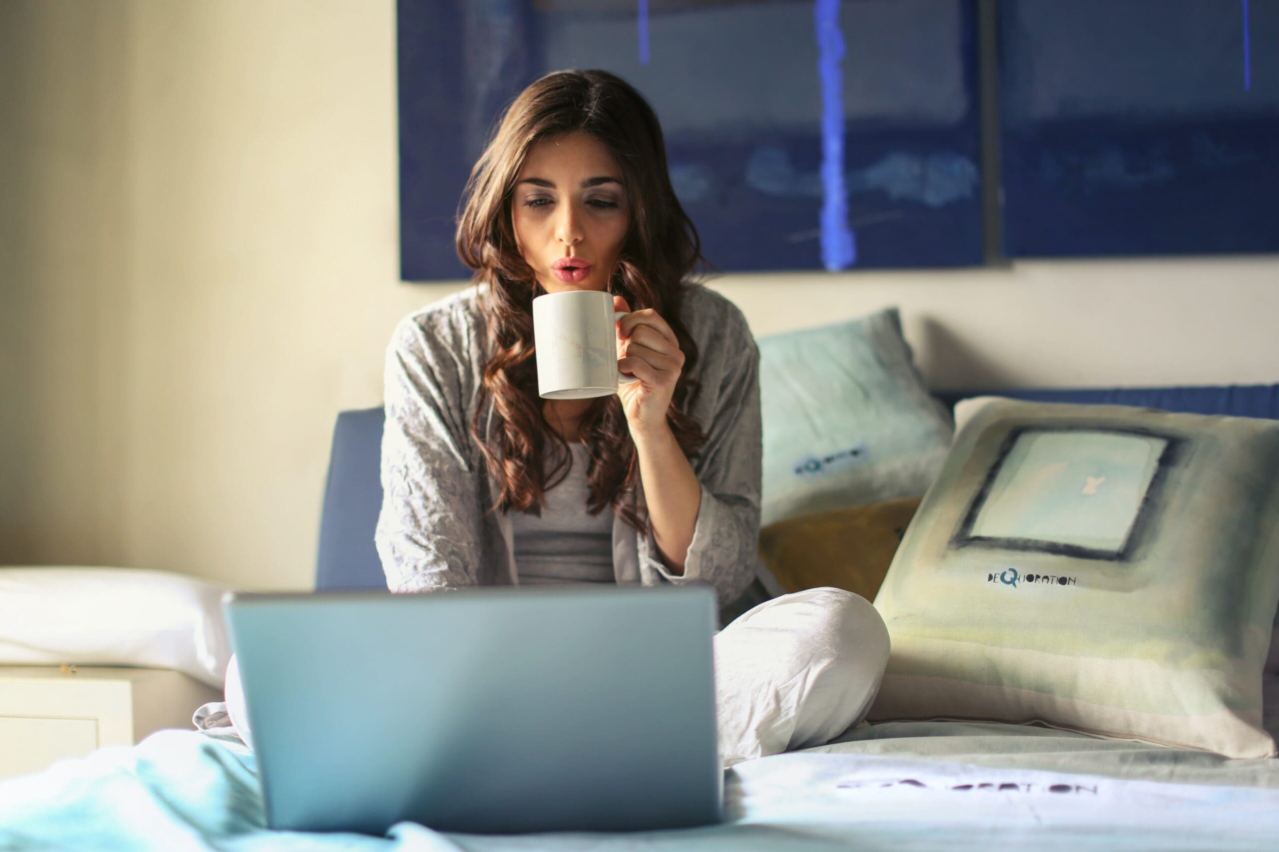 Woman at laptop following up on a sales lead
